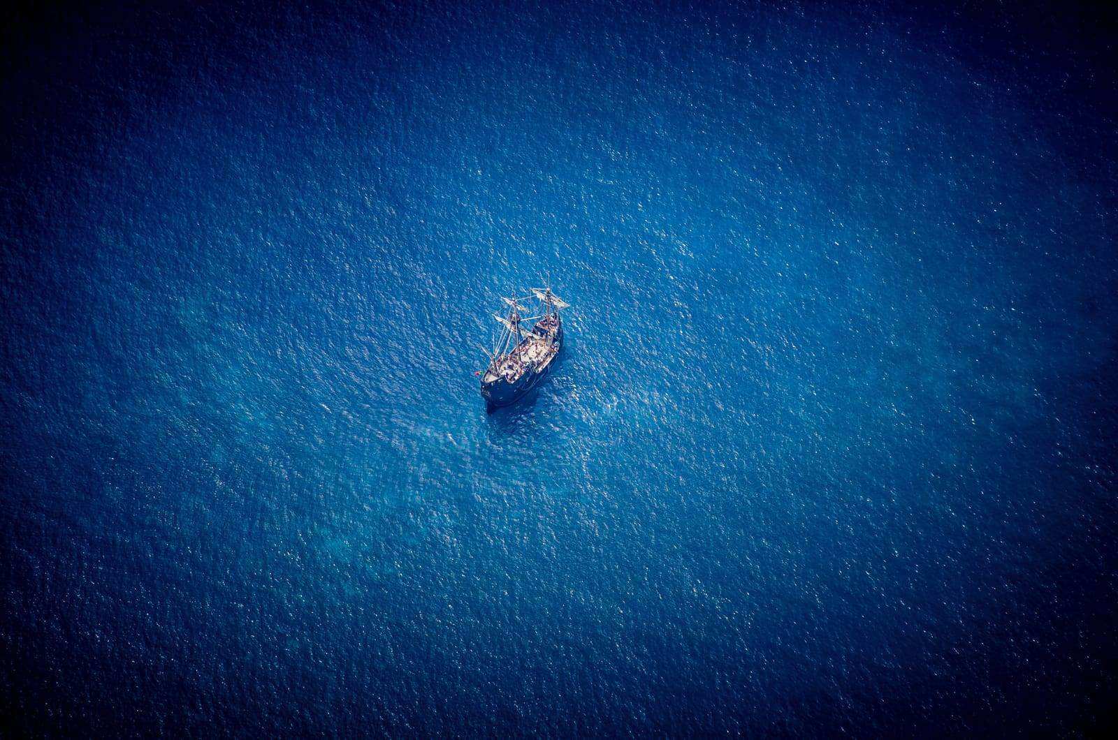 Traditional Madeiran caravella boat on the Atlantic, a symbol of the island's maritime heritage and independent spirit